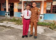Kepala Desa Muara Cuban Antar Anak ke Sekolah di Hari Pertama, Dukung Gerakan GAMAS Bupati Sarolangun